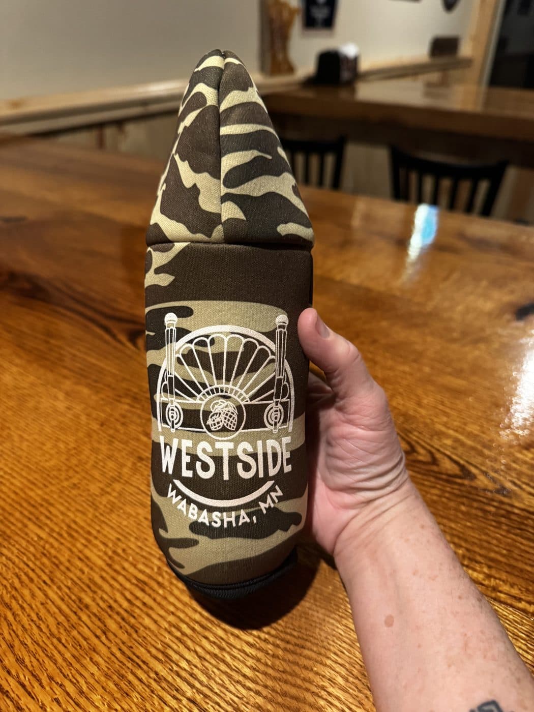 Hooded Bottle Koozie, Camo: Zip-up hoodie bottle koozie with the WESTSIDE crest.