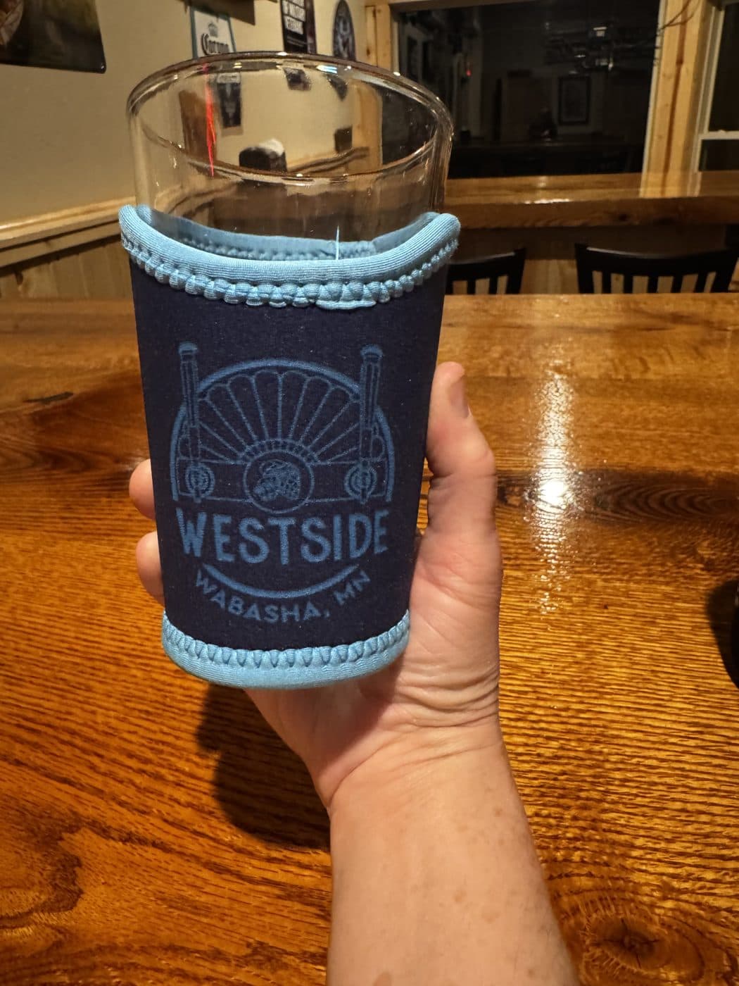 Pint Glass Koozie: Navy pint-glass sleeve with the WESTSIDE crest.